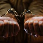 hands in hand-cuffs
