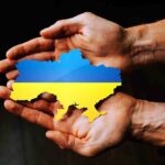 Hands holding Ukraine map