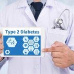 Doctor holding tablet displaying Type 2 Diabetes information
