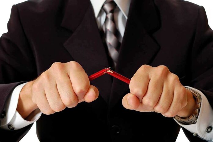 59756248 featured image Person breaking red pencil with both hands