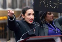 AOC speaking passionately at outdoor event.