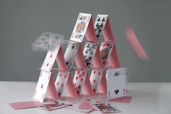 2130029 featured image Collapsing house of cards in motion
