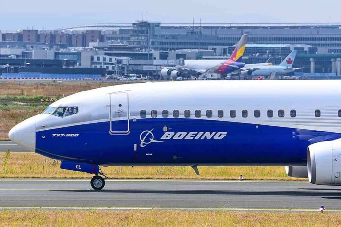 2406303801 featured image Boeing 737-800 on airport runway with other planes