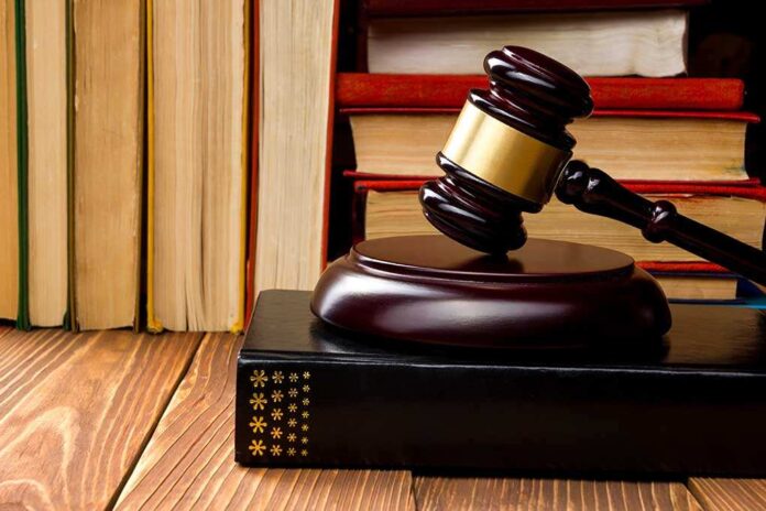 340874837 featured image Gavel resting on books in front of bookshelf.