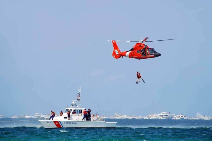 72834631 featured image Coast Guard helicopter rescue above sea with boat nearby
