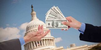 Hands exchanging money in front of Capitol building