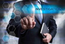 Man in suit pointing at Investigations text