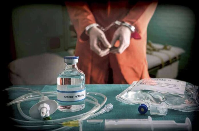 765745765 featured image Handcuffed person with sodium thiopental on table.