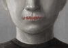 Face with mouth sewn shut in red thread