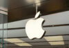 Illuminated Apple logo inside a store