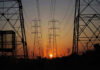 Transmission towers at sunset