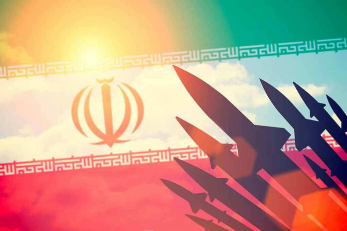 Silhouettes of missiles over Irans flag graphic