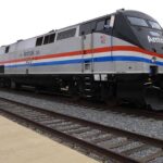 Trump SLASHES Waste: $26 Million Train Axed Amtrak locomotive parked at a railway station