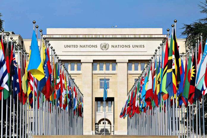 United Nations building with numerous national flags outside