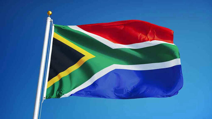 478550506 South African flag waving against blue sky