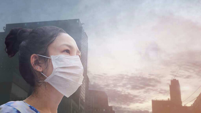 Person wearing a mask in a cityscape background