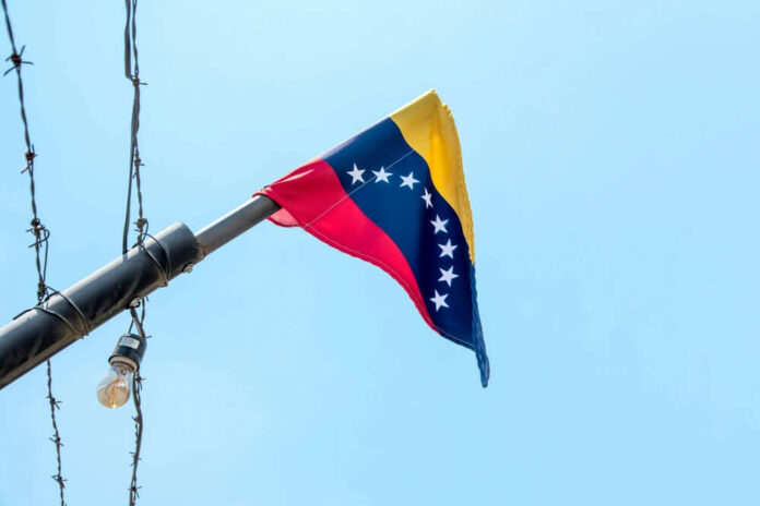 Venezuelan flag flying on a pole