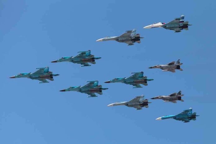 A formation of military jet fighters flying in a clear blue sky