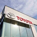 Toyota CEO’s MAGA Move Stuns Japan Exterior view of a Toyota dealership with a prominent logo