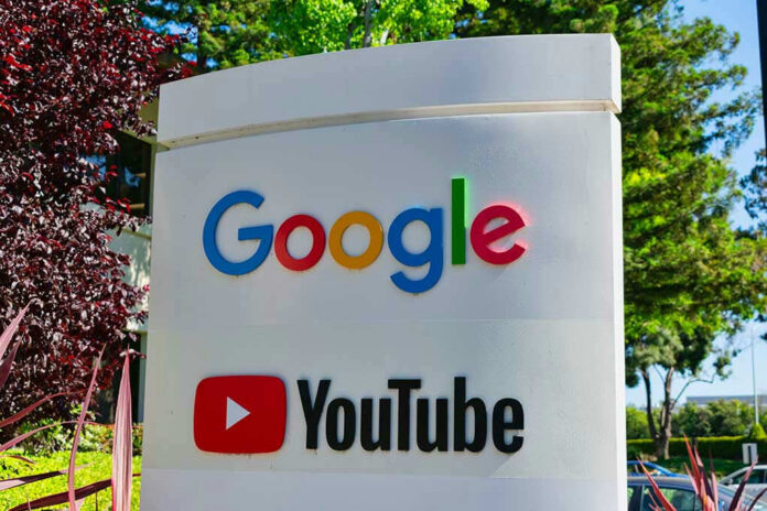 1424645474 Google and YouTube sign with trees in background.