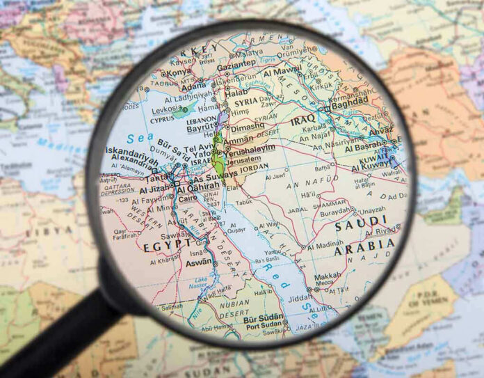 162063665 Magnifying glass over Middle East map highlighting Israel and Egypt.