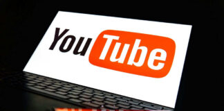 YouTube logo on a laptop and smartphone screen.