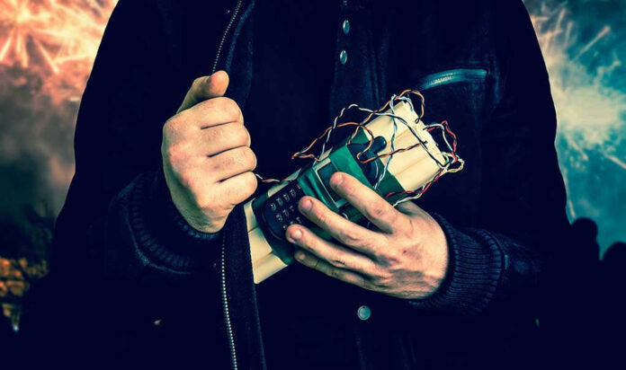 529327423 Person holding a homemade explosive device.