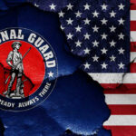 Trump’s National Guard Pullout – What’s Behind It? National Guard logo over a distressed American flag.