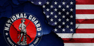 National Guard logo over a distressed American flag.