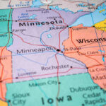 2,000 Agents Storm Minneapolis Map highlighting Minnesota, North Dakota, South Dakota, Wisconsin.