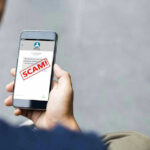 Digital Assault: Phones Under Siege! Person reading a scam message on a smartphone.
