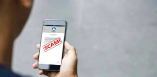 Person reading a scam message on a smartphone.