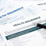 Insurance Premium SHOCK: 21 Million Americans Face Huge Hikes Close-up of health insurance application forms with a pen