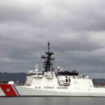 Coast Guard’s Bold Pre-Dawn Seizure A U.S. Coast Guard ship docked under cloudy skies