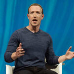 Zuckerberg’s Bold Move—Privacy Groups Sound ALARM Person speaking on stage with blue background.