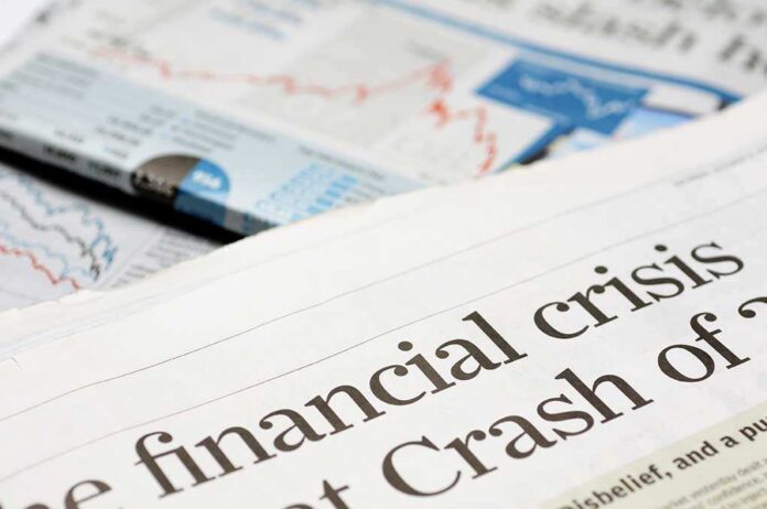 Close-up of a newspaper headline about a financial crisis