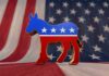 Rising Dem Star Makes Outrageous Religion Claim — Backlash EXPLODES! A donkey symbol representing the Democratic Party in front of an American flag background