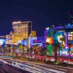 Vibrant view of the Las Vegas Strip at night with neon lights and traffic