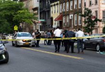 Car Crash or Deliberate Attack? Modena’s Mystery Police gathered at an urban crime scene.