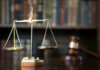 Georgia Democrat Hit with Explosive Subpoena! Scales of justice with gavel and books.