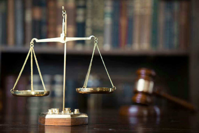 1673822626 Scales of justice with gavel and books.