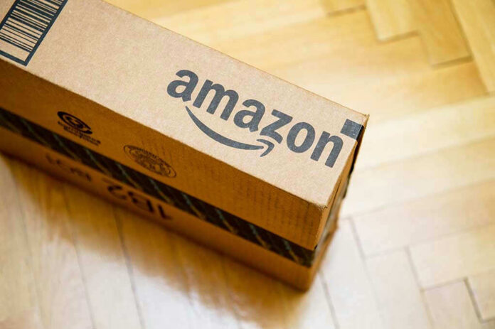 373709401 Amazon package on wooden floor.