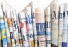 Attempt on Trump’s Life: Media to Blame? A collection of rolled newspapers displaying various headlines and designs