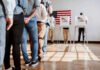 Feds Quietly Grab Voter Files People in line at voting booths.