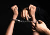 Appeals Bombshell Upends Tina Peters Case Handling handcuffs and unlocking with a key.