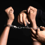Appeals Bombshell Upends Tina Peters Case Handling handcuffs and unlocking with a key.