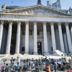 Marijuana Users Keep Guns — Supreme Court Courthouse facade with media crews setting up outside.