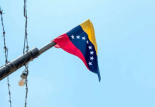 Deep Strike Shocks Venezuela Venezuelan flag flying on a pole.