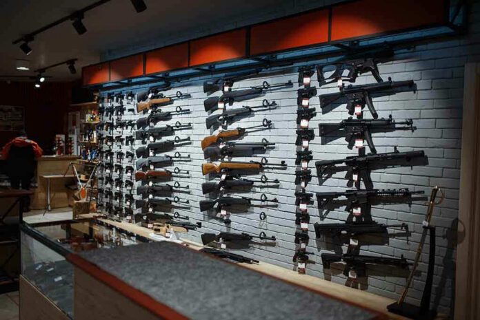 Wall-mounted-guns-displayed-in-a-store Wall-mounted guns displayed in a store.