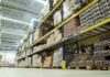 Factory Boom Hype Masks Risky Stockpiles Interior view of a warehouse with stacked shelves of packaged goods
